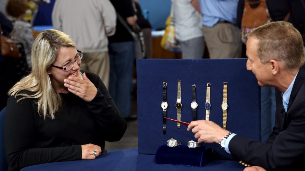 A man evaluates watches at an Antiques Roadshow