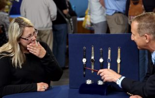 A man evaluates watches at an Antiques Roadshow